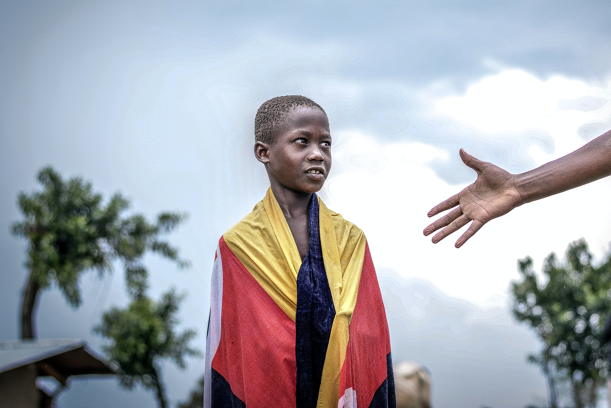 african-boy-looking-at-a-raised-hand.jpg african-boy-looking-at-a-raised-hand.jpg